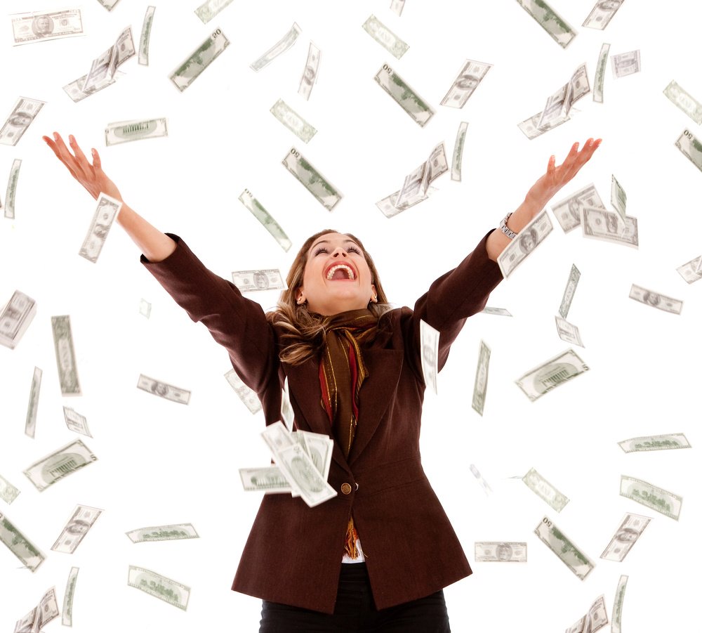 Business woman under a money rain - isolated over a white background