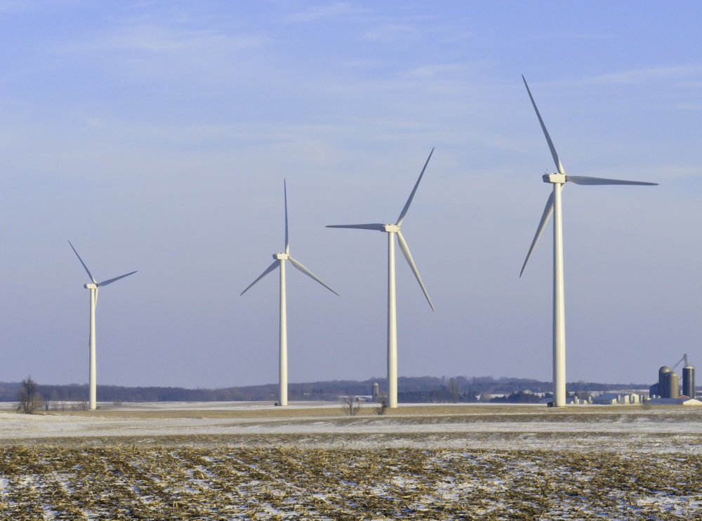 Rural skyscrapers Four wind turbines dominate snowy corn fields, Lee County, Illinois, in January