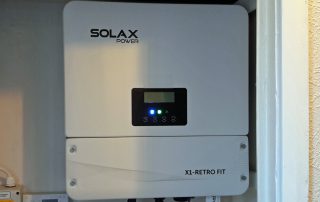 One of our PowerBanx SolaX inverters installed in a hall cupboard (Image: Tanjent)