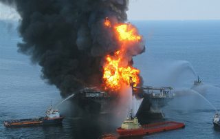 Anchor handling tugs and platform supply vessels combat the fire on the Deepwater Horizon while the U.S. Coast Guard searches for missing crew (Image: USCG)