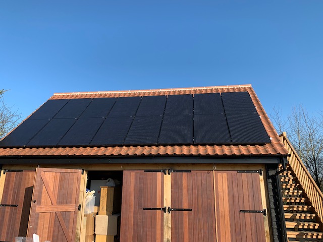 Solar panels installed on the garage roof for Mr RM, Colchester (CO6), Essex