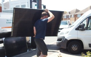 Unloading solar panels ready to install (Image: Tanjent)