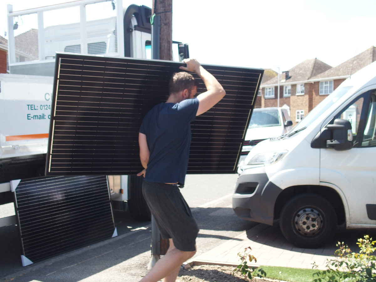 Unloading solar panels ready to install (Image: Tanjent)