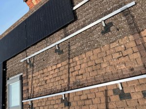 Solar panel rails on a clay tile roof - note the Hookstop rubber tiles (Image: Tanjent)
