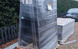 Solar panels stacked on a pallet (Image: Tanjent)